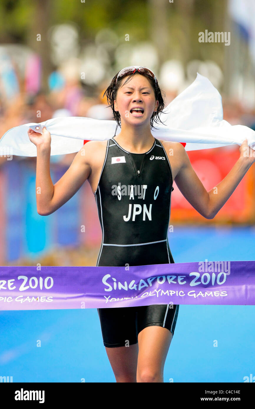 YOG Women's Triathlon champion, Sato Yuka(JPN), crosses the finishing line in 1:00:49.69 hours. Stock Photo