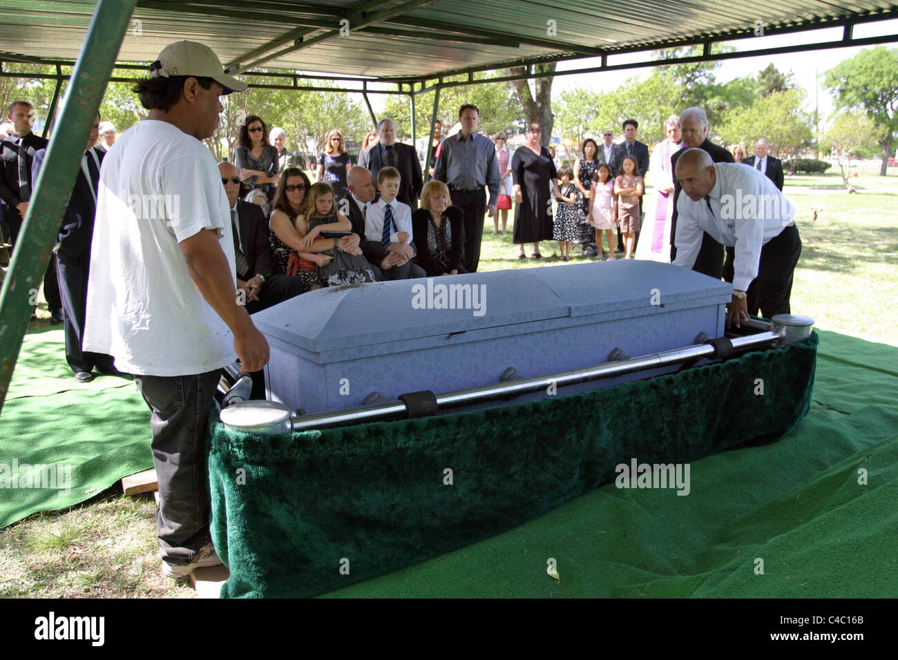 Family burying family member in Texas USA Stock Photo