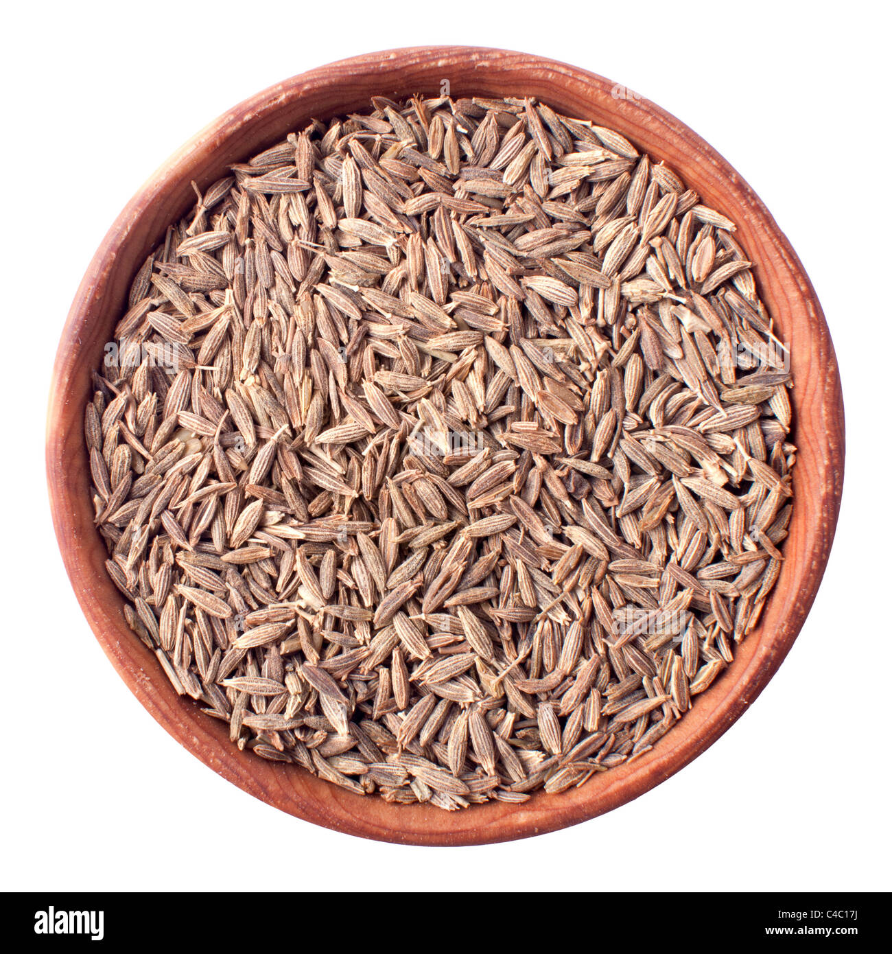 caraway seeds in a wooden bowl isolated on white Stock Photo Alamy