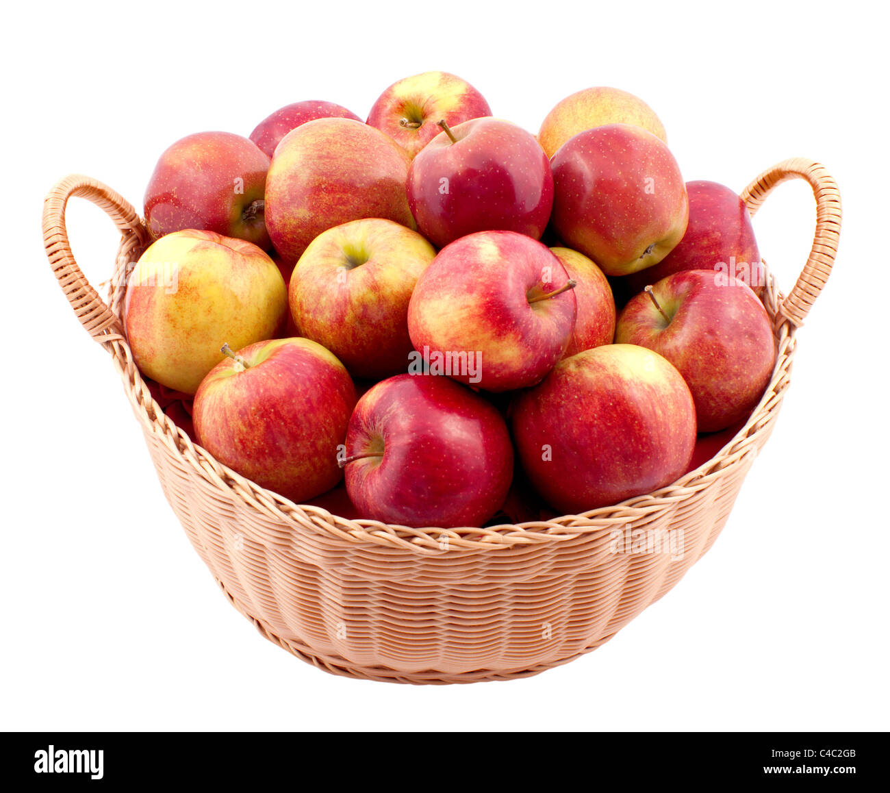 Wicker basket full of apples isolated on white Stock Photo - Alamy