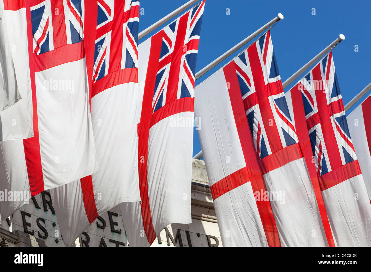 Royal Navy White Ensigns flying above Admiralty Arch along The Mall in London Stock Photo