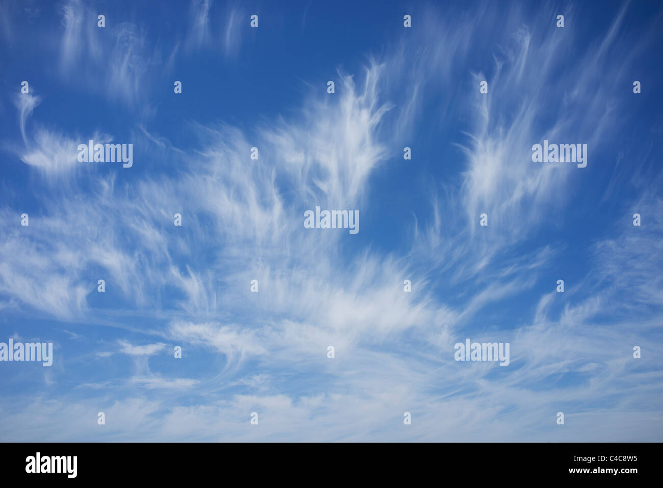 cloudscape with wispy clouds forming in the sky Stock Photo