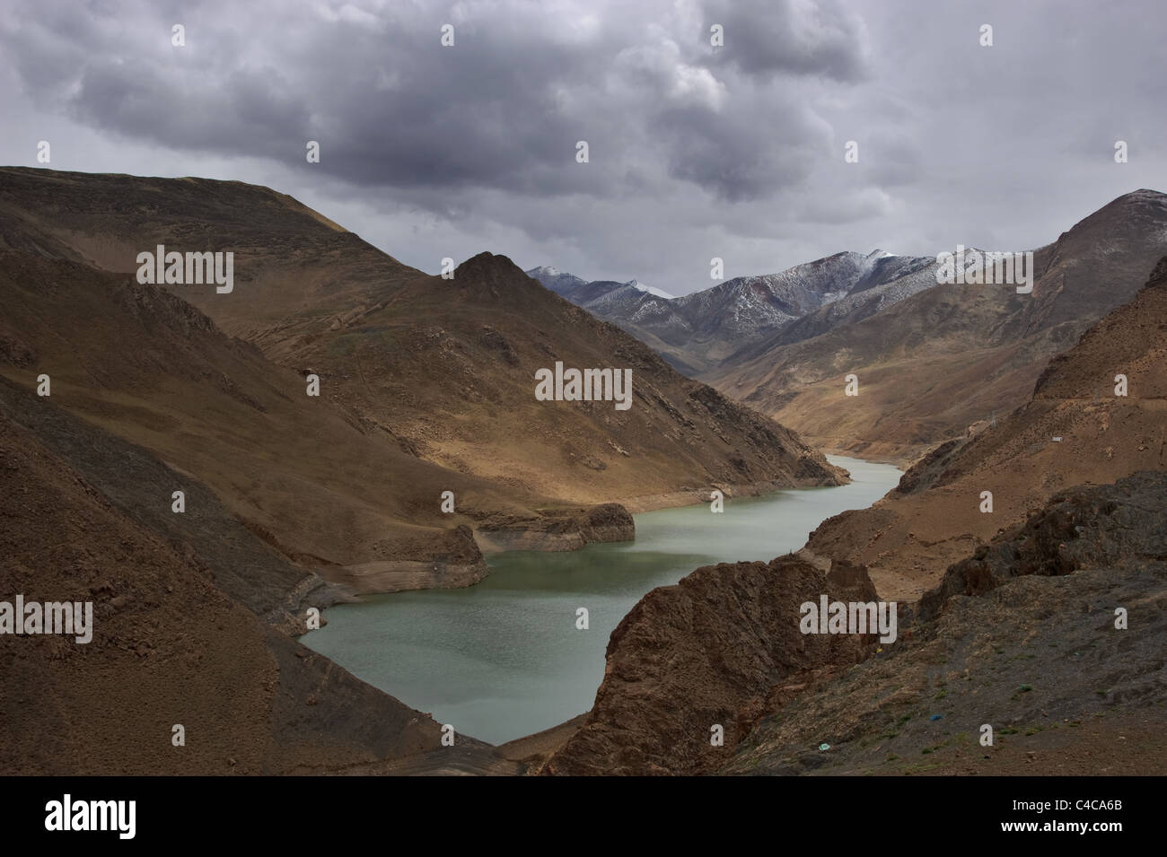 Landscape of Himalaya mountains and lake in Tibet in clouded weather Stock Photo