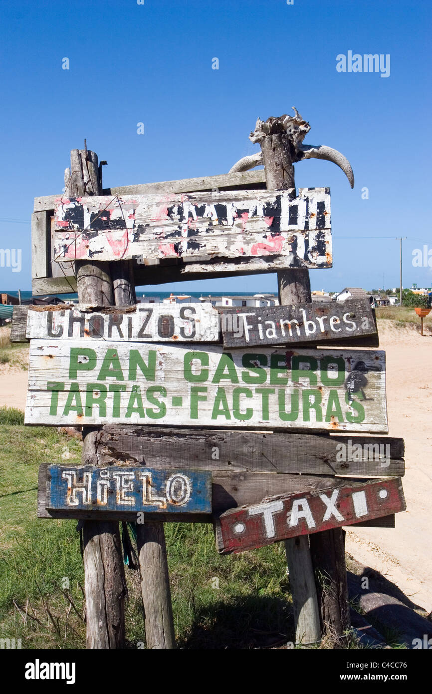Wooden sign with adds in Cabo Polonio. Uruguay. Stock Photo