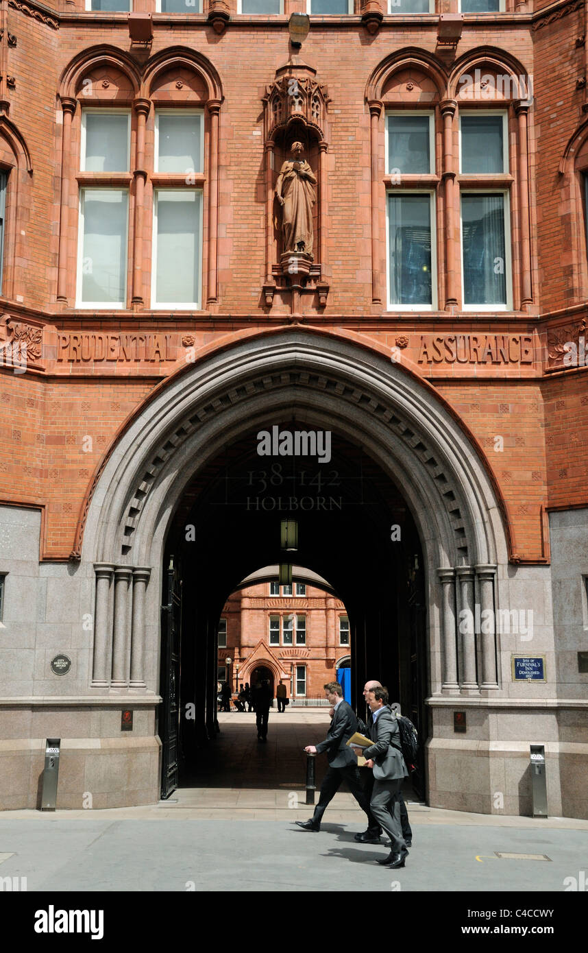 People passing the entrance to The old Prudential Assurance Building in High Holborn London England UK Stock Photo