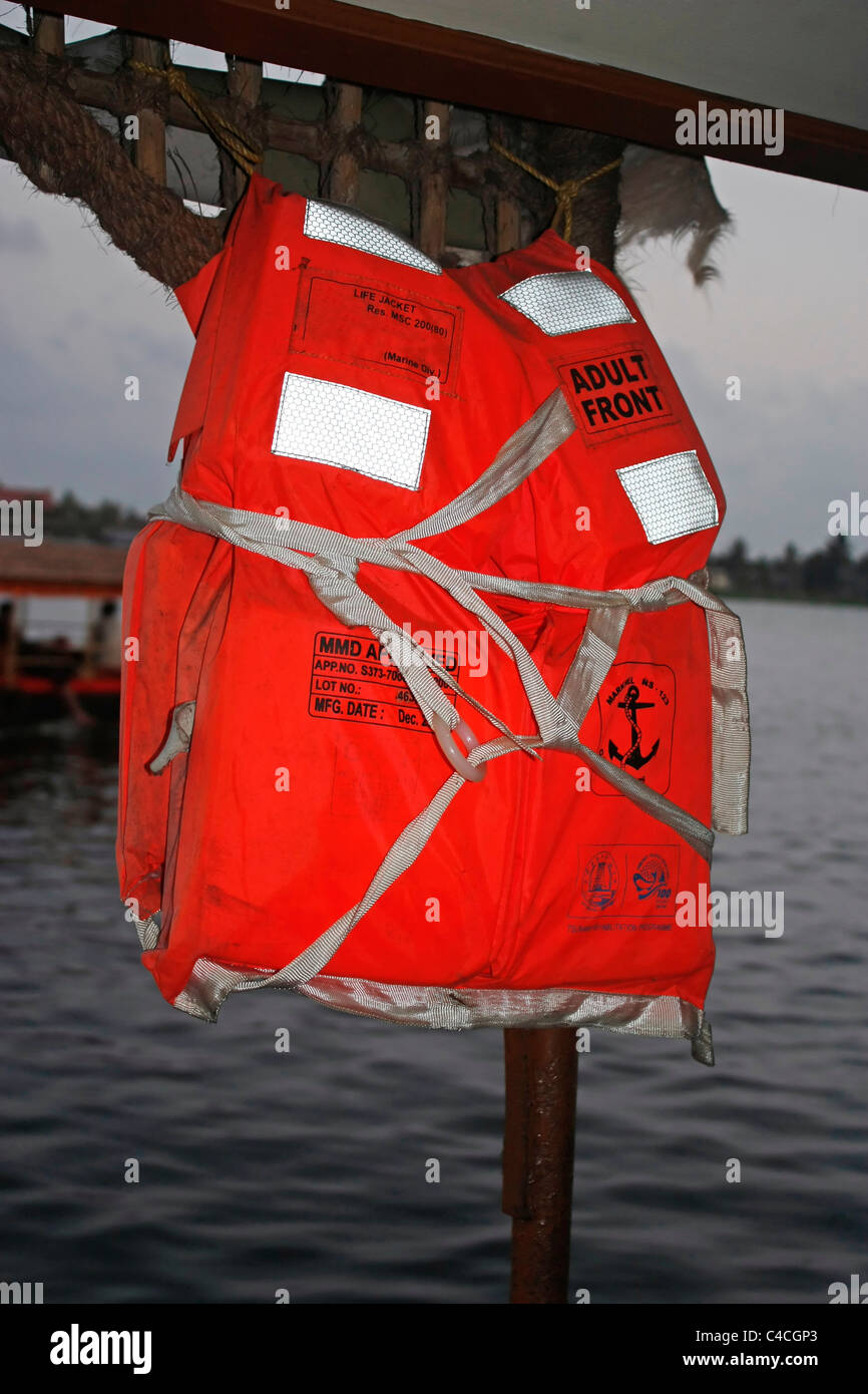 A Life Jacket hanging from the wall of a hose boat Stock Photo