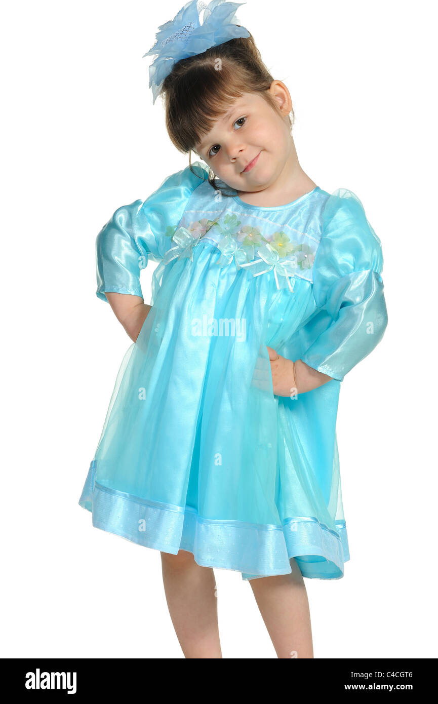 Pretty the little girl in a blue dress. It is isolated on a white ...