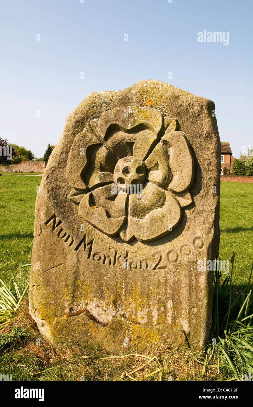nun monkton millennium date stone English village yorkshire rose carved Stock Photo
