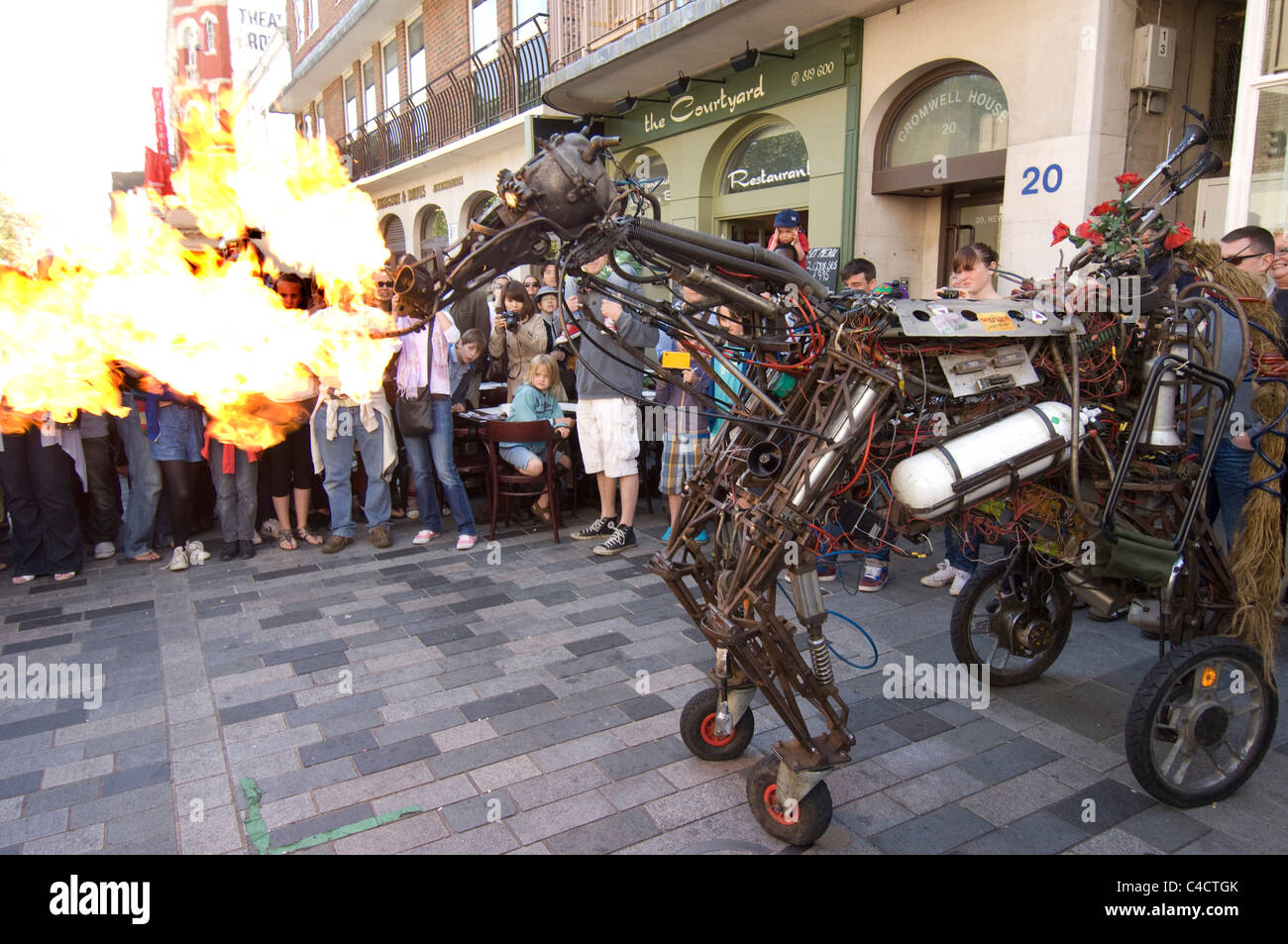 A fire breathing iron horse entertains crowds during the 2011 Brighton Festival Fringe Stock Photo
