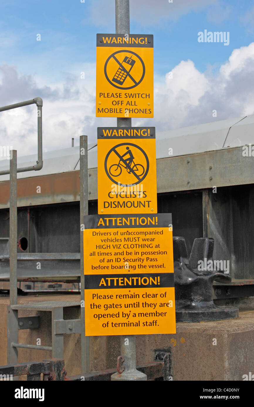 Warning notices at the Kennacraig to Port Askaig ferry terminal Stock Photo