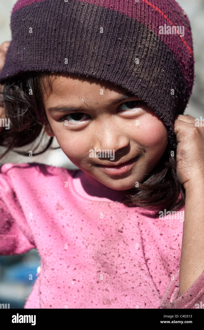 A little child living in the trash dump of Kathmandu Stock Photo