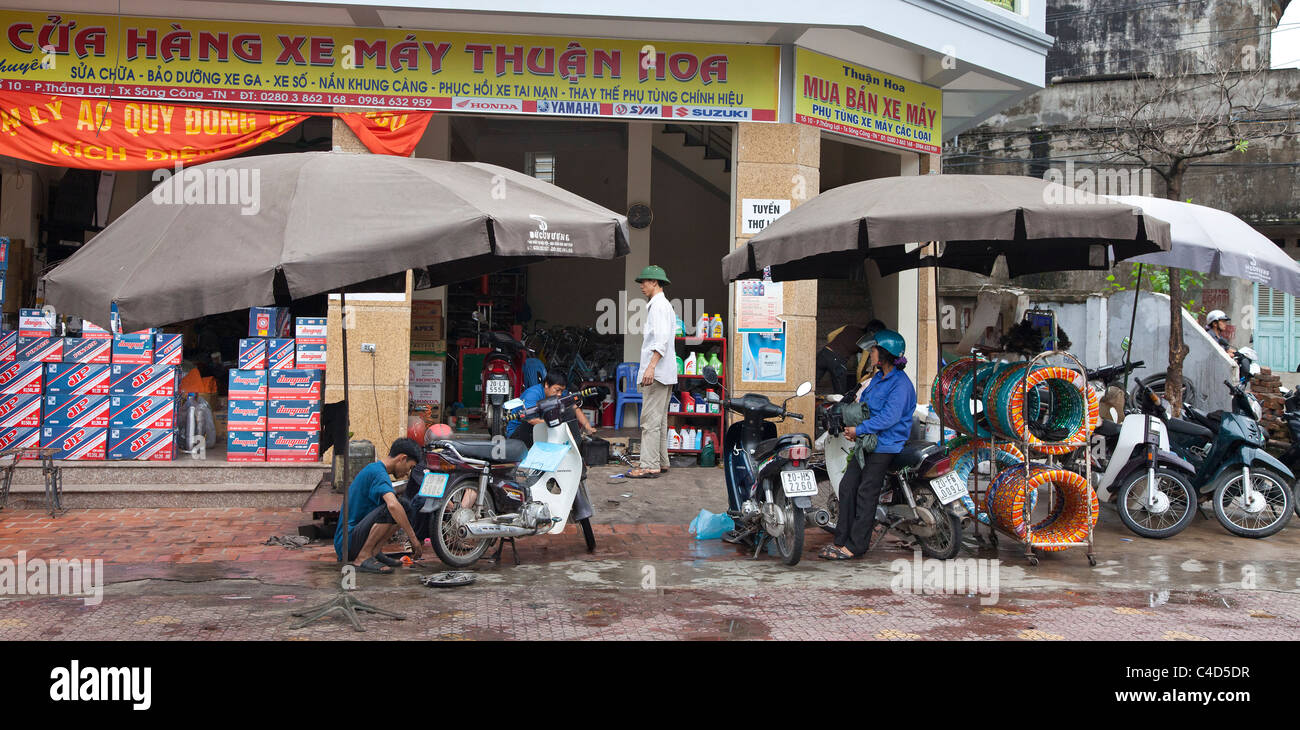 North Vietnam street scene, motor cycle repair shop Stock Photo