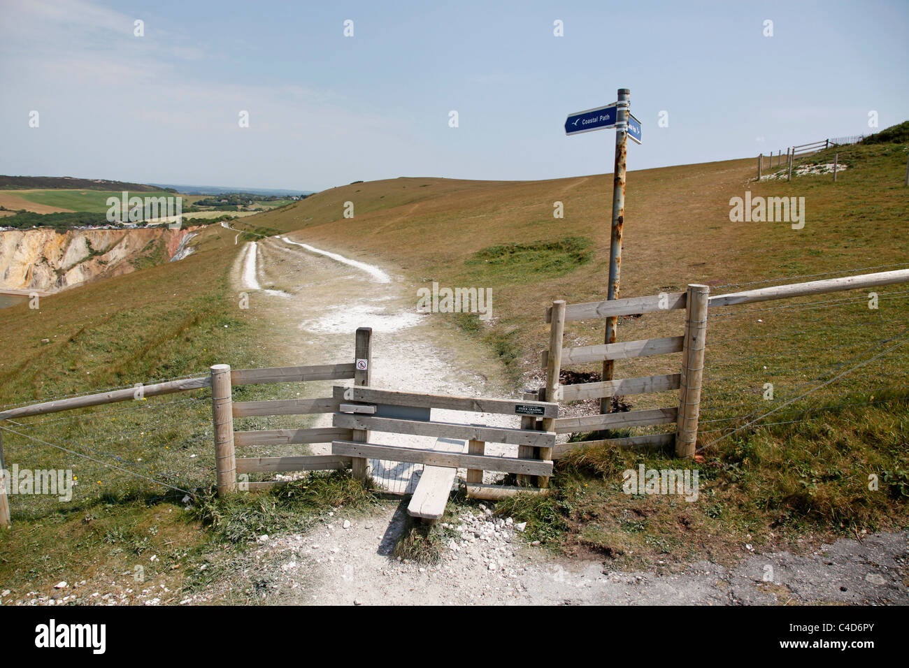 Coastal path and wooden stile on the Isle of Wight, England Stock Photo