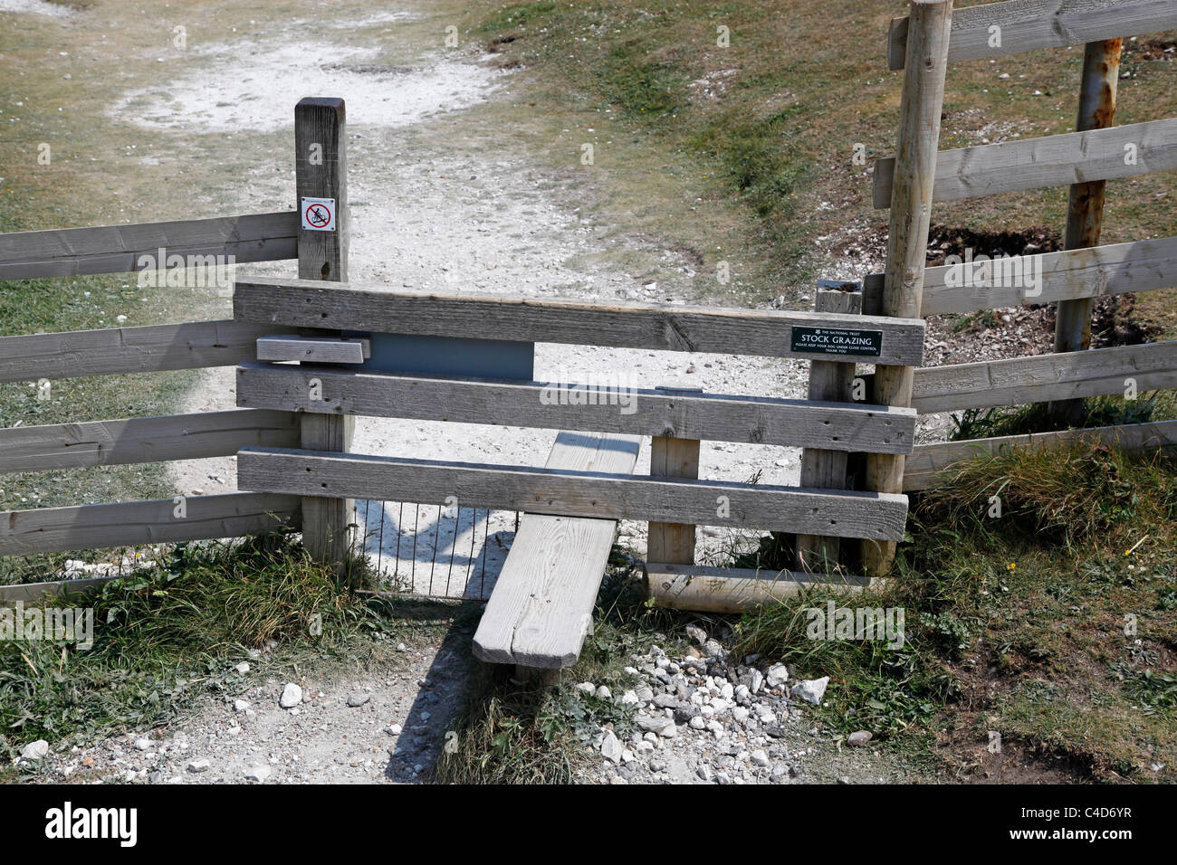 Coastal path and wooden stile on the Isle of Wight, England Stock Photo