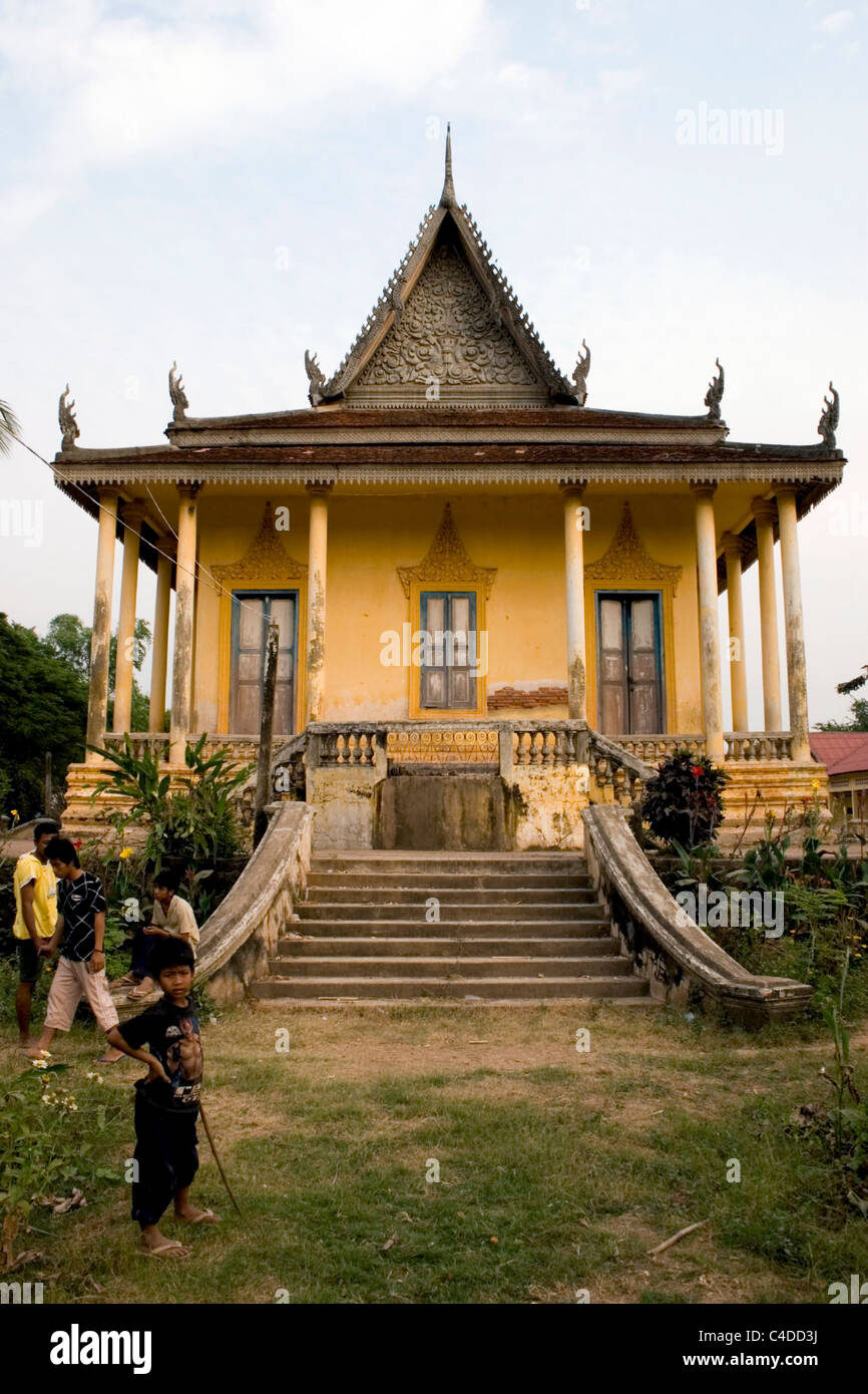 People are gathered at an old Buddhist temple in rural Cambodia. Stock Photo