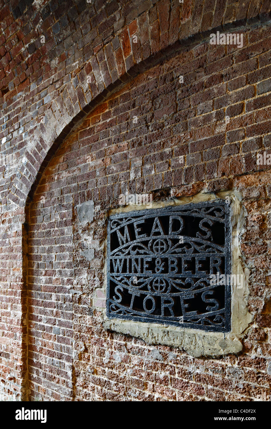 Old fashioned iron grate advertising Meads Stores. Stock Photo