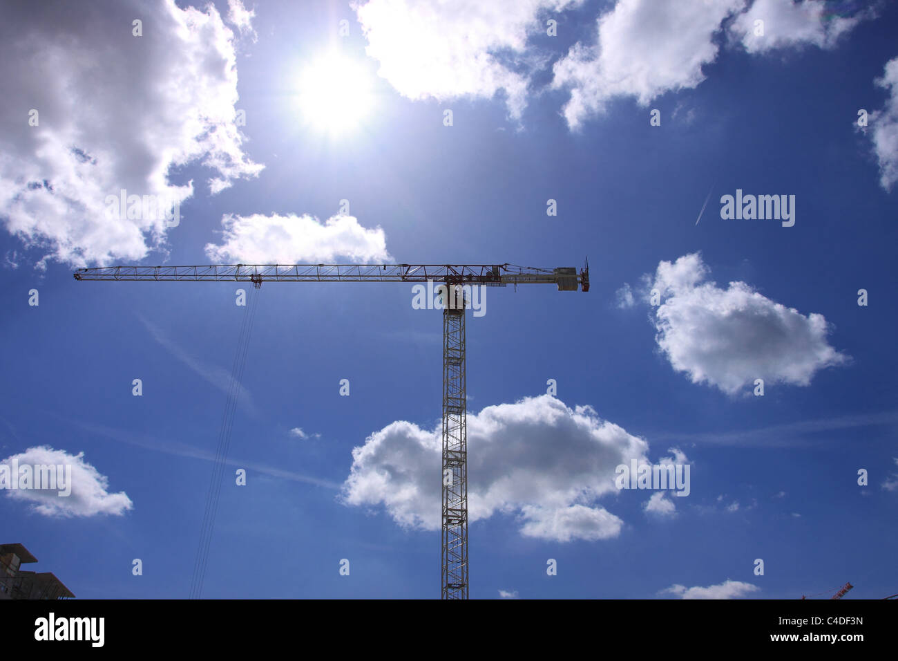 Construction crane against the blue sky Stock Photo - Alamy