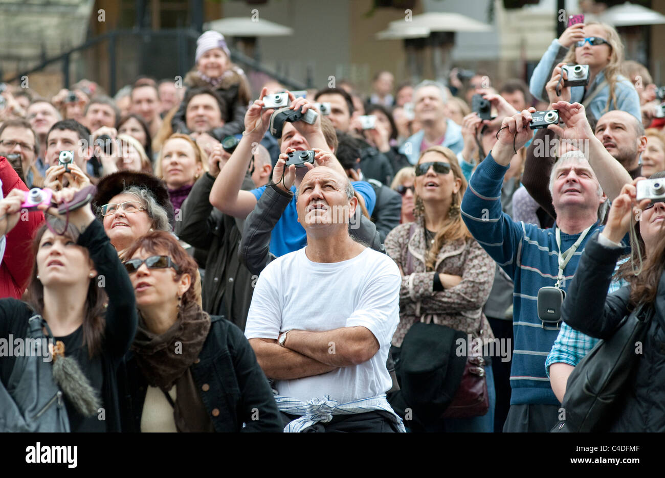 Crowds of tourists gather each hour to watch the fascinating mechanism of the Astronomical clock in Prague's Old Town Square. Stock Photo
