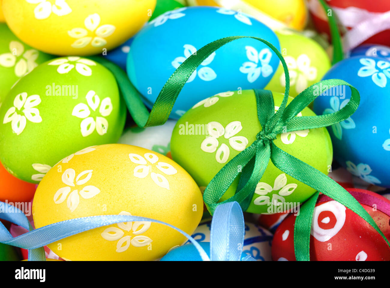 Painted easter eggs with bows uniform background Stock Photo - Alamy