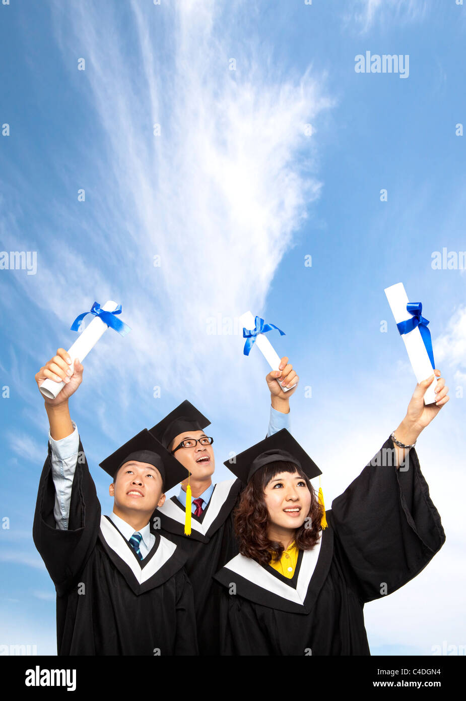 happy group of graduation students holding their diploma Stock Photo