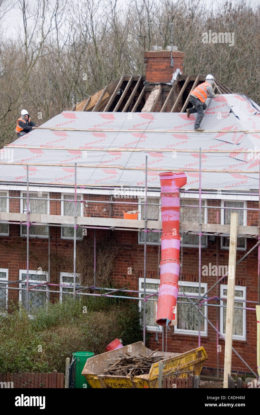 Two Men Wrapping Roof of House with Breathable Roofing Felt, Re Roofing ACIS Properties, Hastilar Road South, Sheffield, 2011 Stock Photo