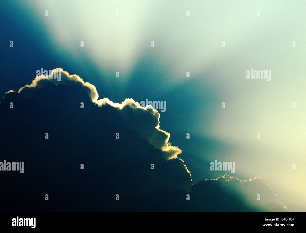 sun rays from behind cloud Stock Photo - Alamy