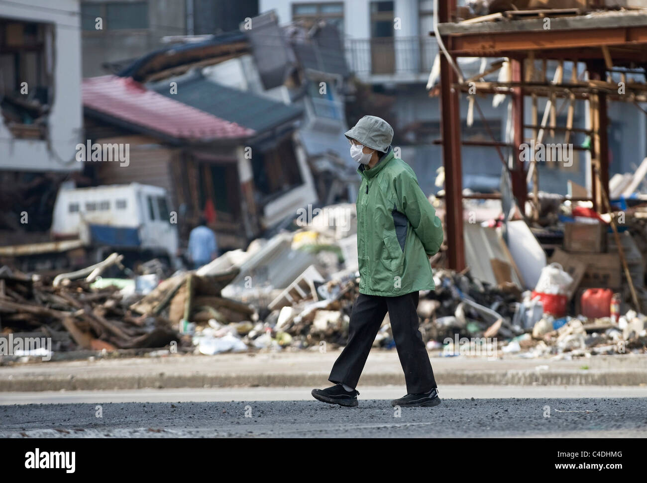 3 months after the magnitude 9 quake and tsunamis hit Japan, Yoko Sano, 83, re-visits the district where her home once stood Stock Photo