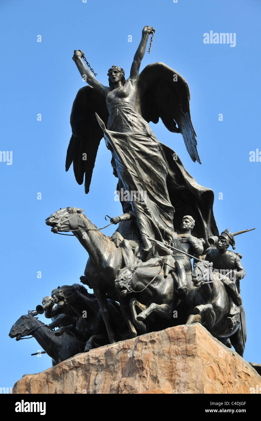 Blue sky view bronze horse grenadiers and advancing Liberty figure, Army of Andes Monument, Cerro Gloria, Mendoza, Argentina Stock Photo