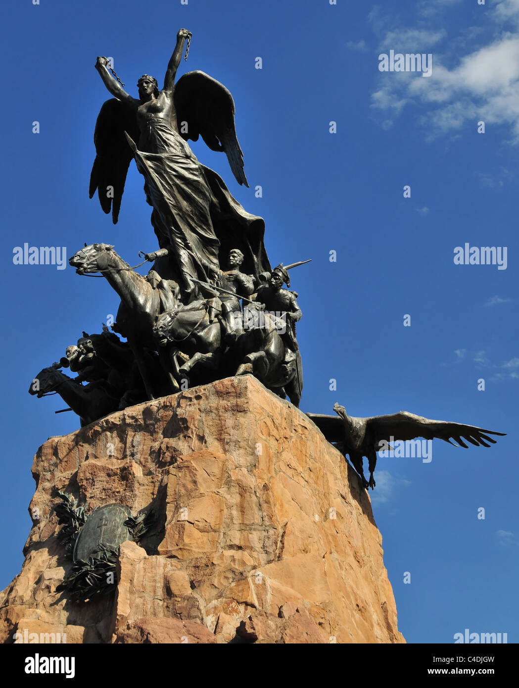 Blue sky bronze Liberty figure, horse grenadiers and condor in flight, Army of Andes Monument, Cerro Gloria, Mendoza, Argentina Stock Photo
