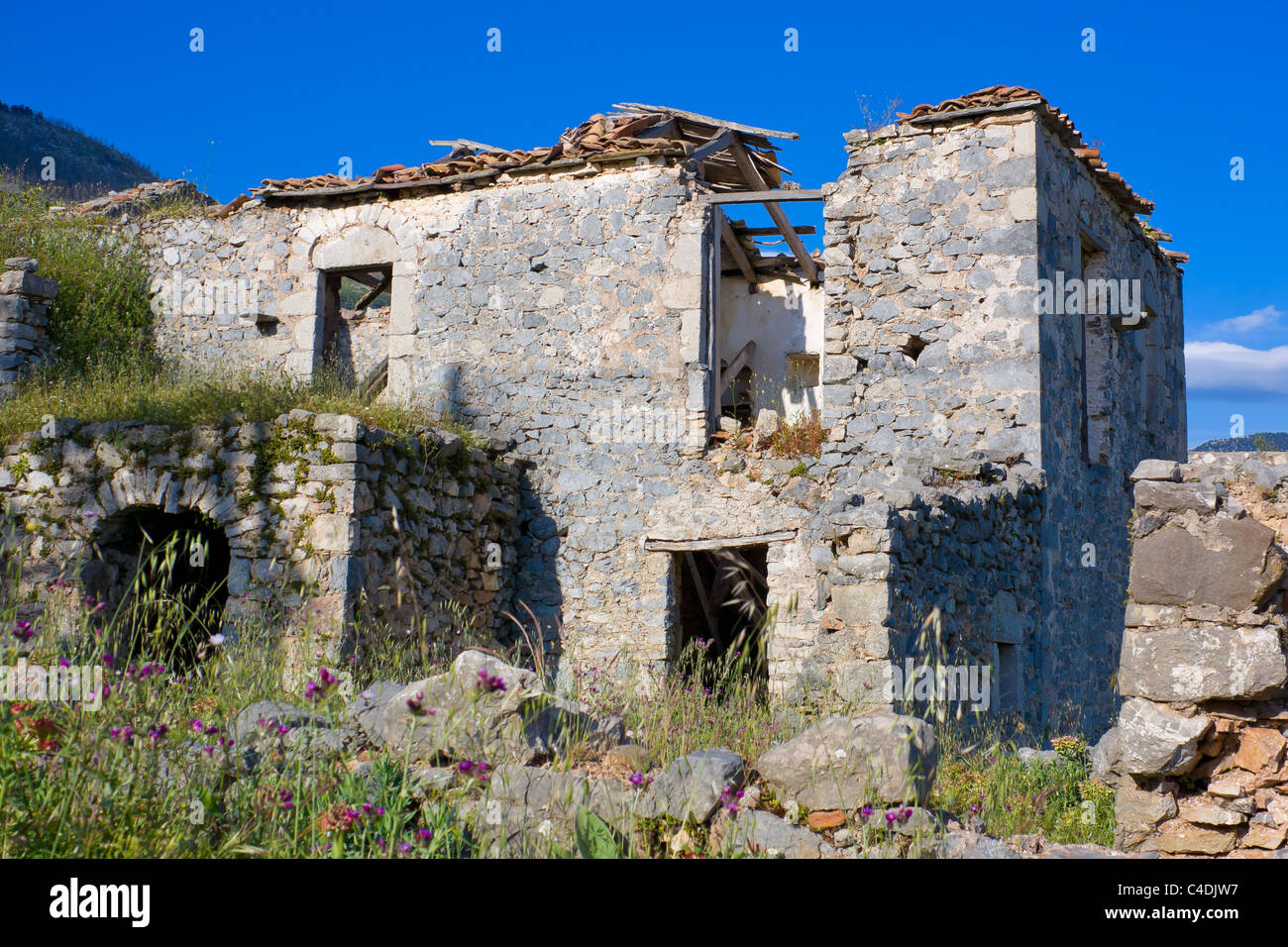 Abandoned and ruined old house after an earthquake in Greece Stock Photo