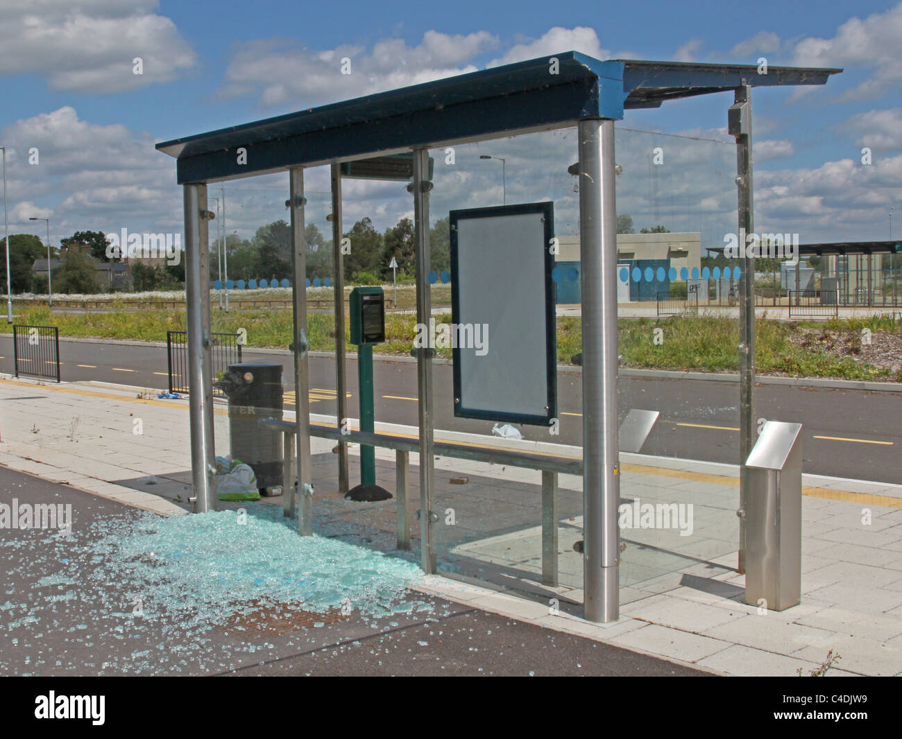 Bus stop vandalised by smashing the glass windows Stock Photo Alamy