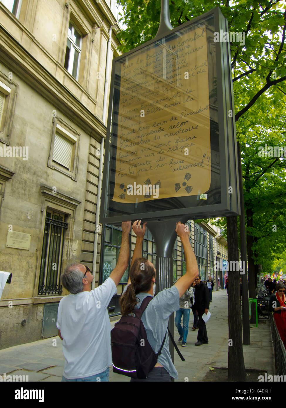 Paris, France, Demonstration Against Nuclear Power, Guerrilla Outdoor Advertising Poster, Replaced Commercial Ad, volunteer work Stock Photo