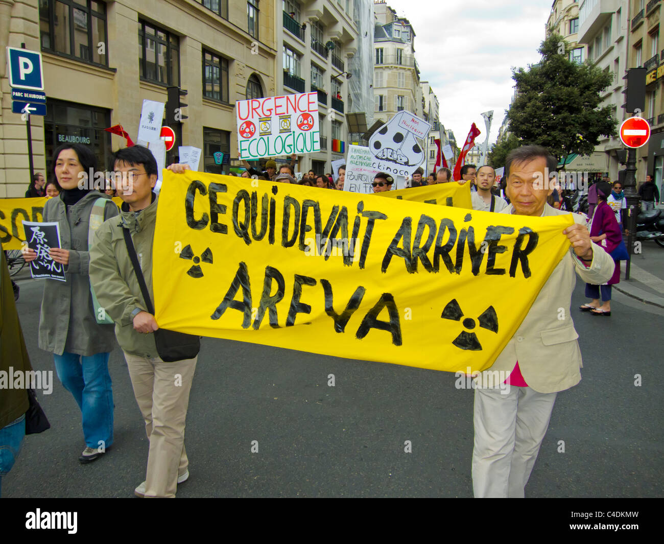 Paris, France, Environmental Demonstration Against Nuclear Power, Japanese Men Marching with Sign, Areva Corporation Stock Photo