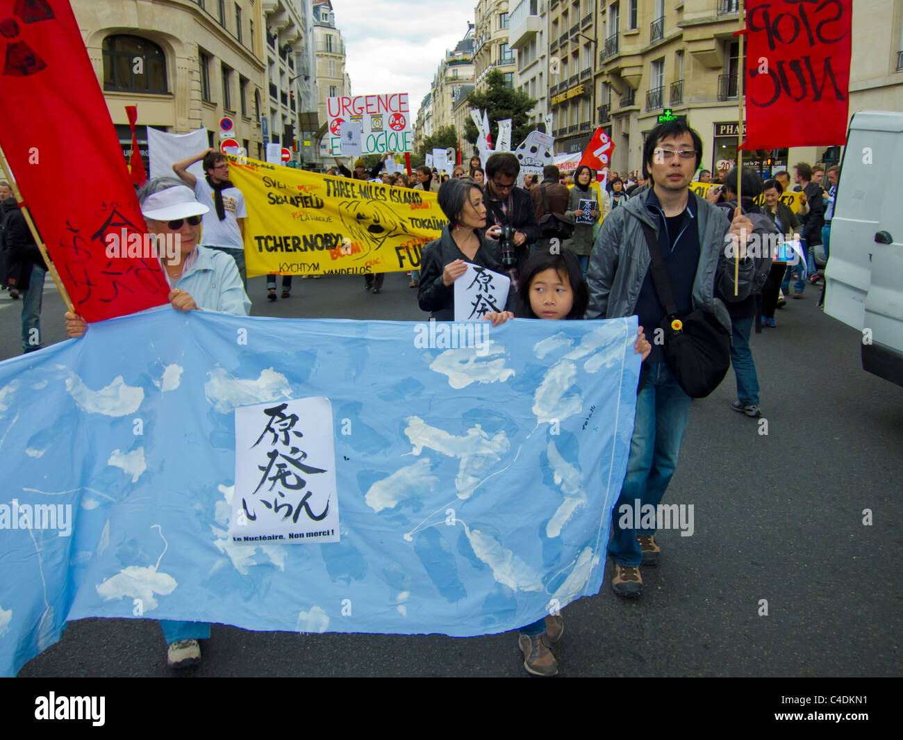 Paris, France, French Demonstration Against Nuclear Power, Japanese Children Marching with Signs, nuclear energy protest Stock Photo