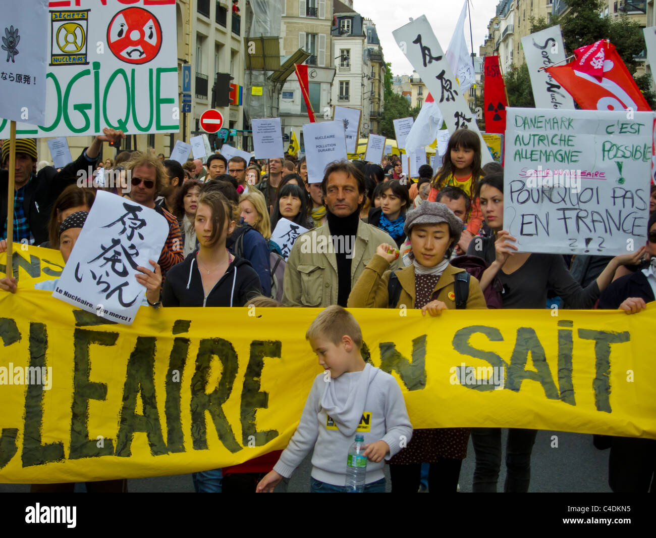 Paris, France, Crowd of People, Environmental Demonstration Against Nuclear Power, Marching with Protest Signs, Banner Stock Photo