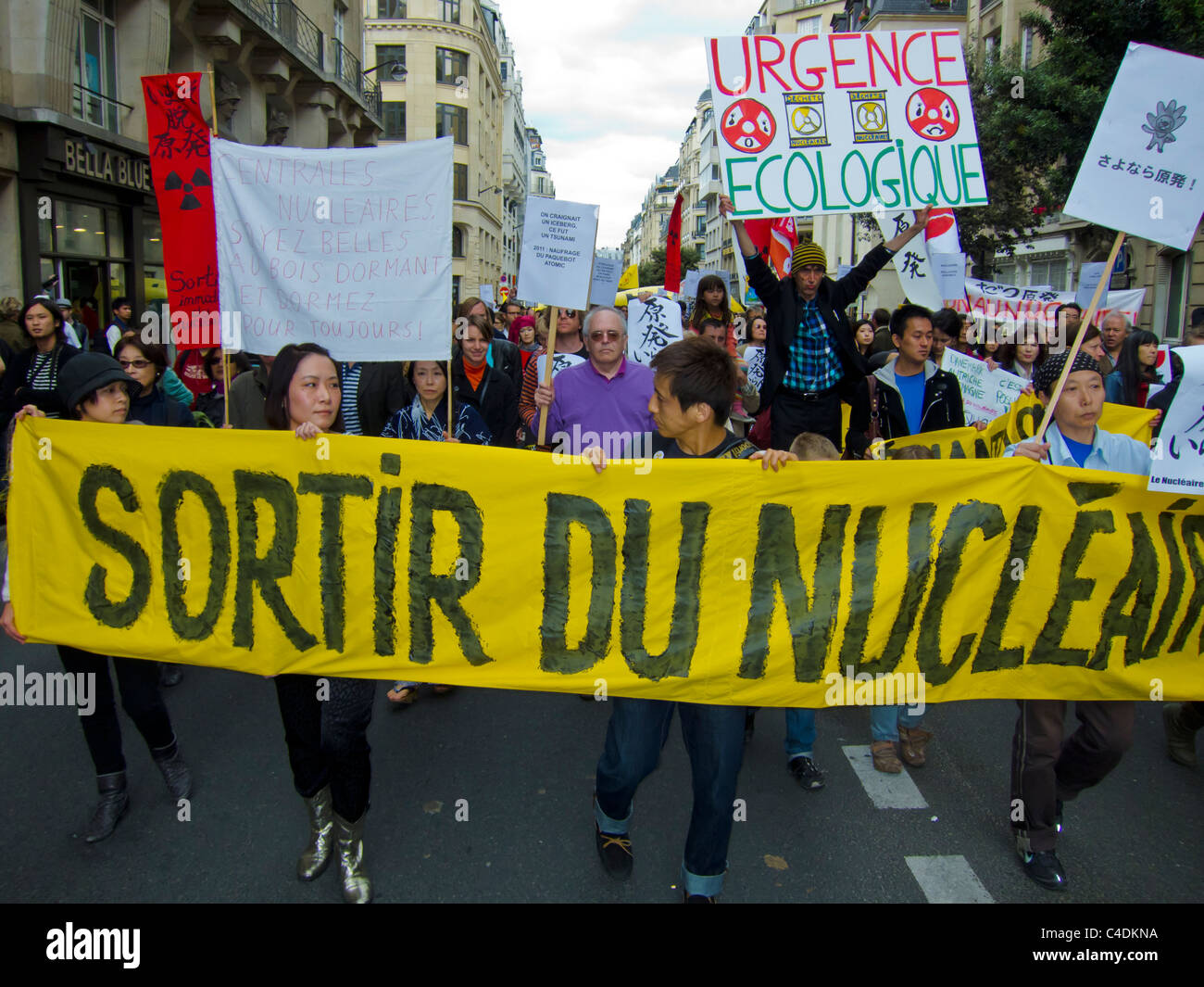 Paris, France, Environmental Demonstration Against Nuclear Power, People Marching with Signs on Street, volunteer work, nuclear energy protest Stock Photo