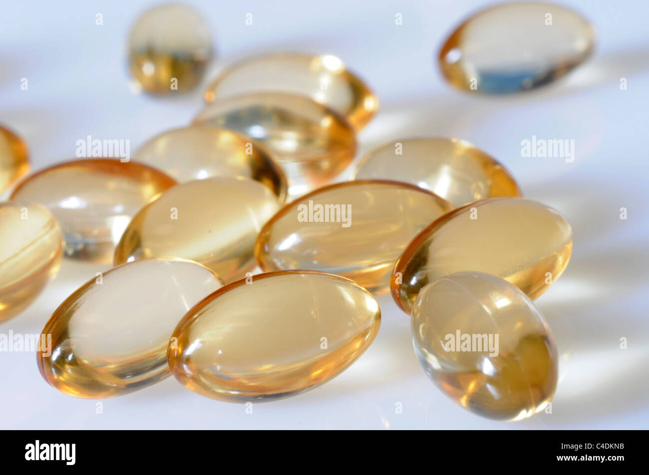 Macro of a bunch of yellow gel pills Stock Photo Alamy