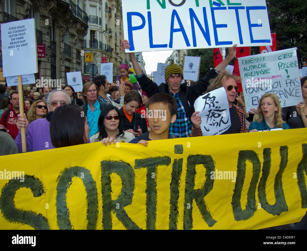 Paris, France, Environmental Demonstration Against Nuclear Power, Children Marching with Protest Signs on Street Stock Photo