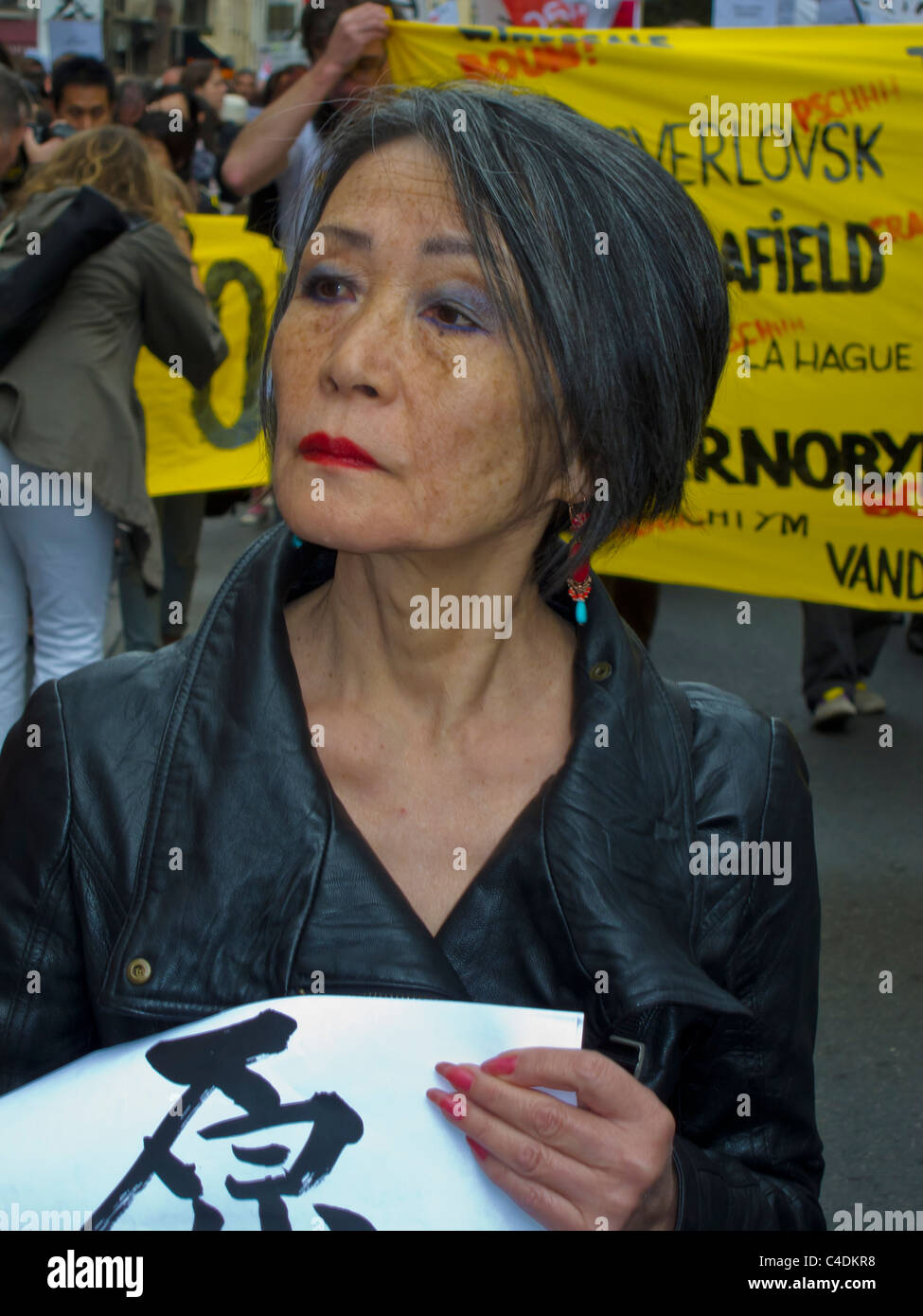 Paris, France, Environmental Demonstration Against Nuclear Power, Portrait, Japanese Woman Protester Marching on Street, with Protest Sign, Stock Photo