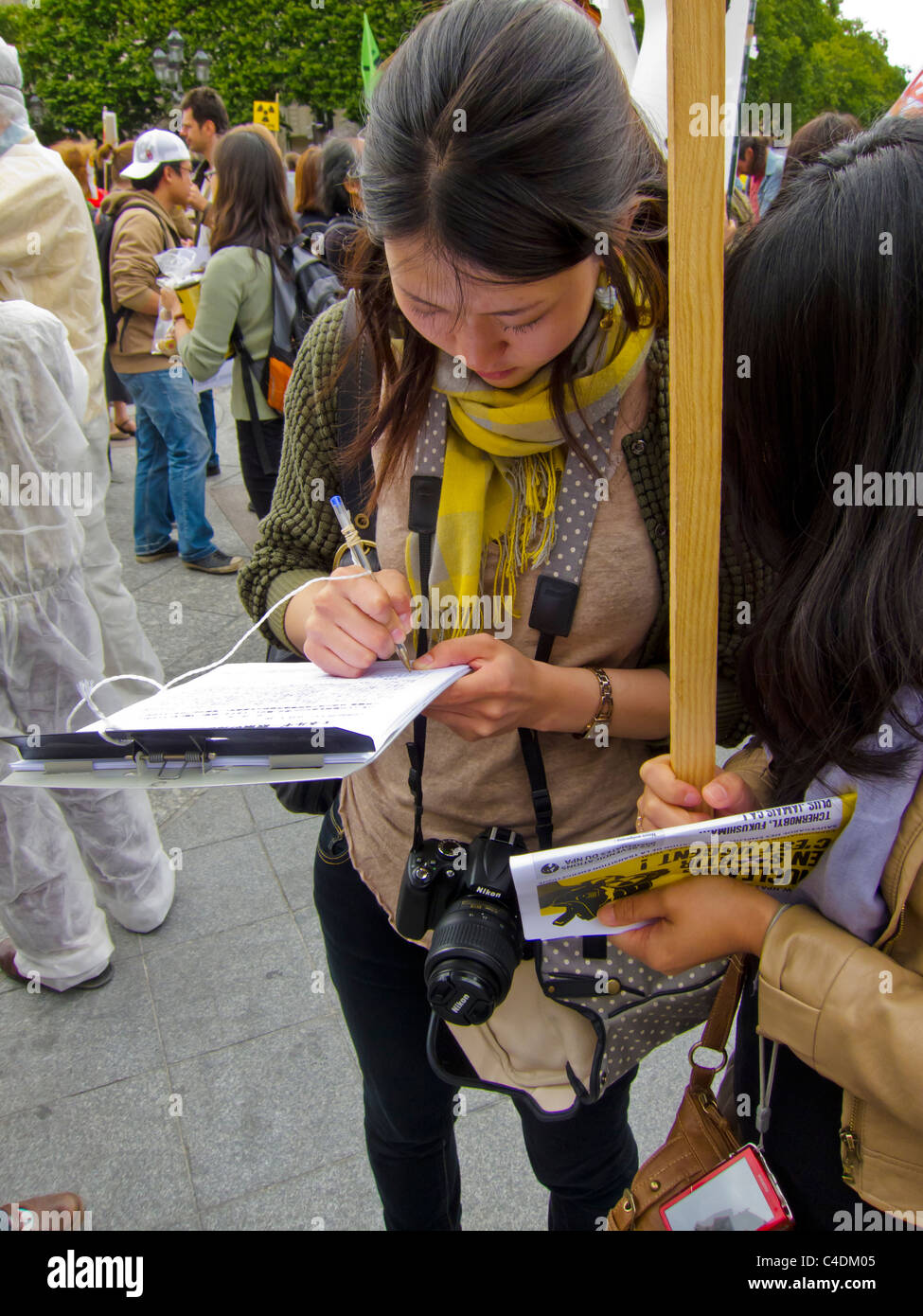 Paris, France, French Demonstration Against Nuclear Power, Japanese Woman Getting Signatures for Petition Stock Photo