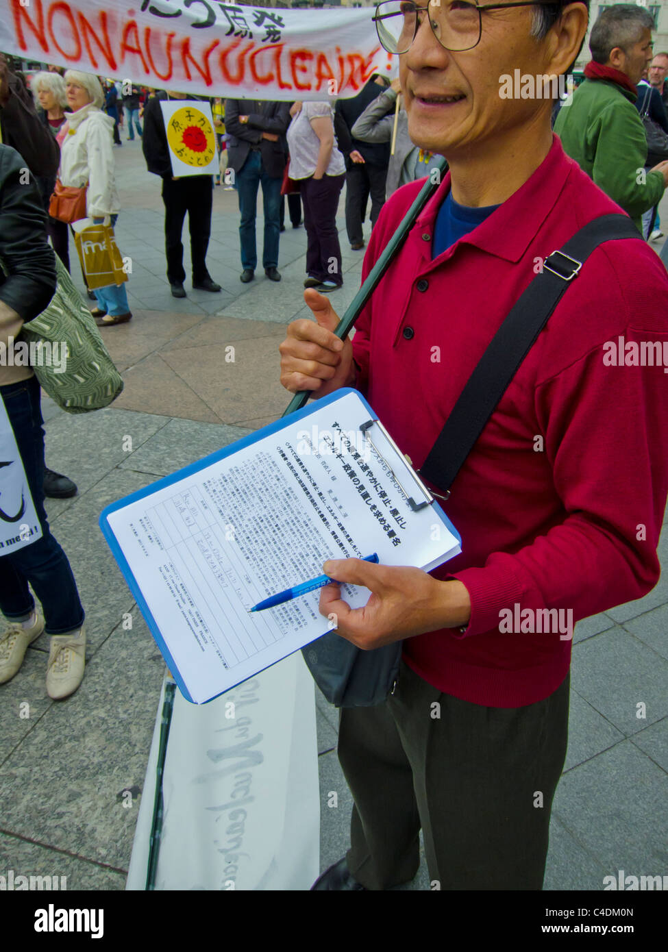 Paris, France, French Demonstration Against Nuclear Power, Japanese Man Getting Signatures for Petition. volunteer NGO work Stock Photo
