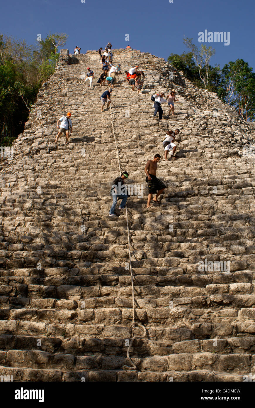 Tourists climbing the Nohoch Mul pyramid at the Mayan ruins of Cobá, Quintana Roo, Mexico. Stock Photo