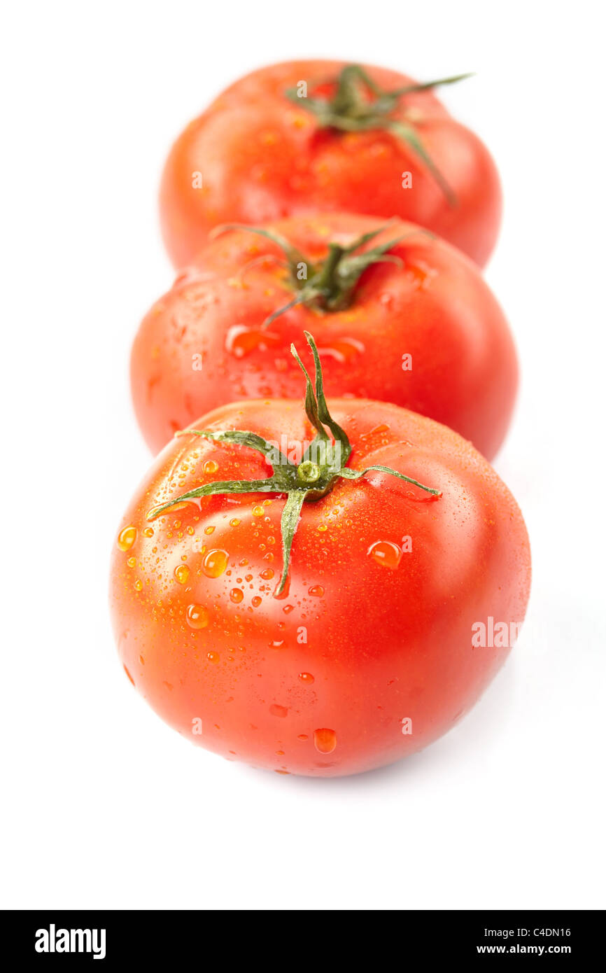 fresh tomatoes on the white background Stock Photo - Alamy