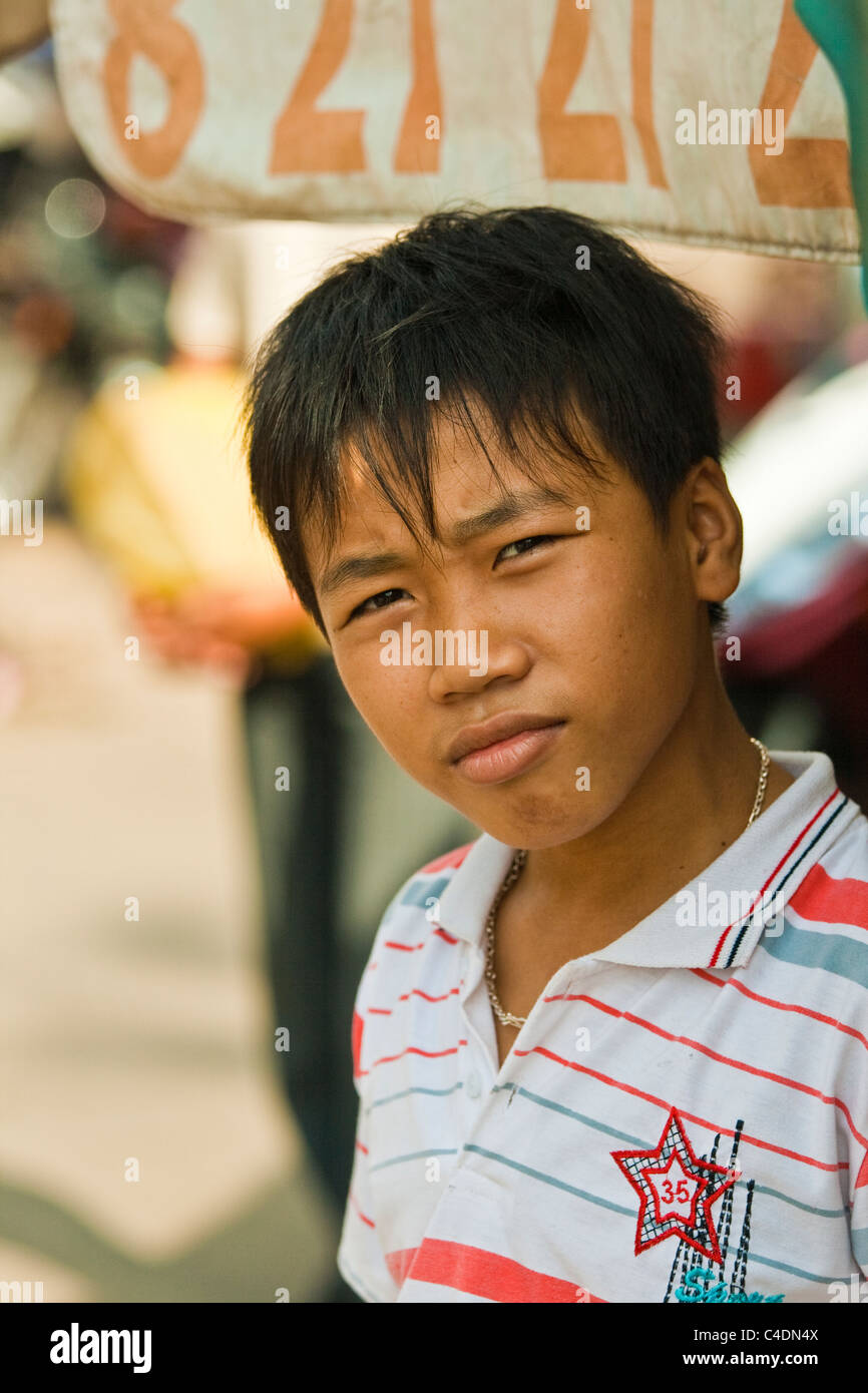 Vietnamese boy in the street Stock Photo - Alamy