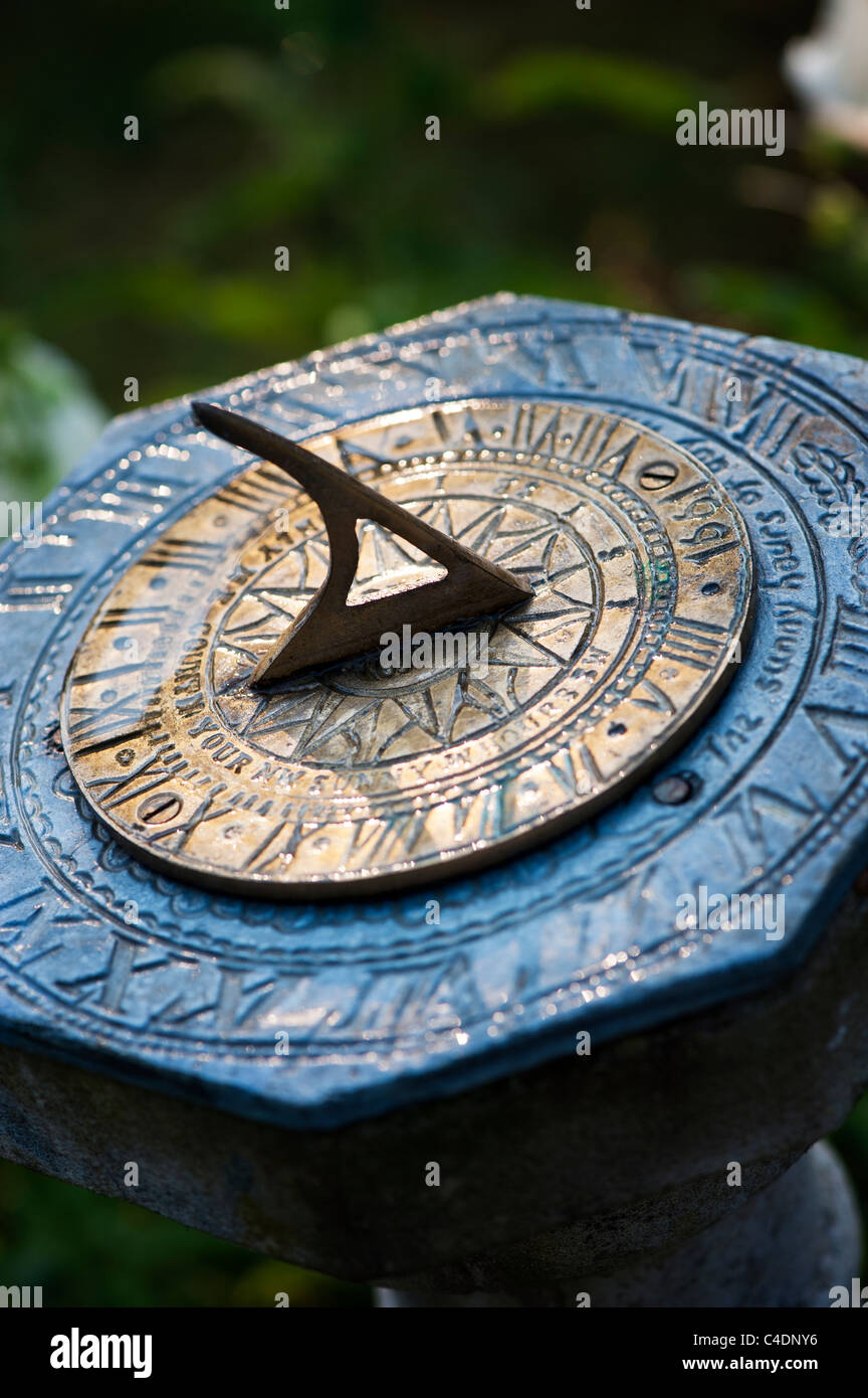 Garden sundial in the early morning sunlight Stock Photo