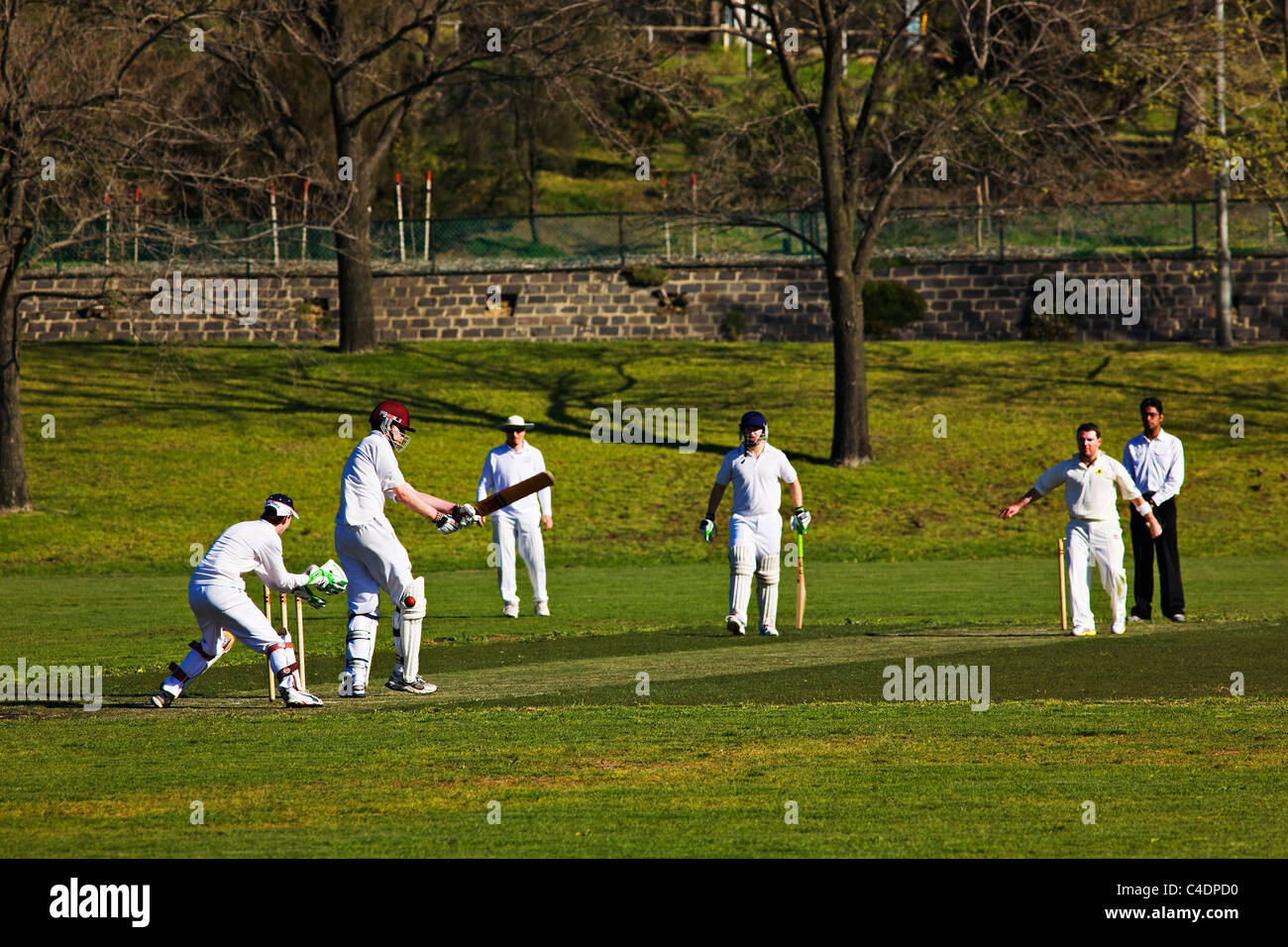 Melbourne Australia  /  An amateur cricket match in progress in the suburb of Royal Park.  . Stock Photo