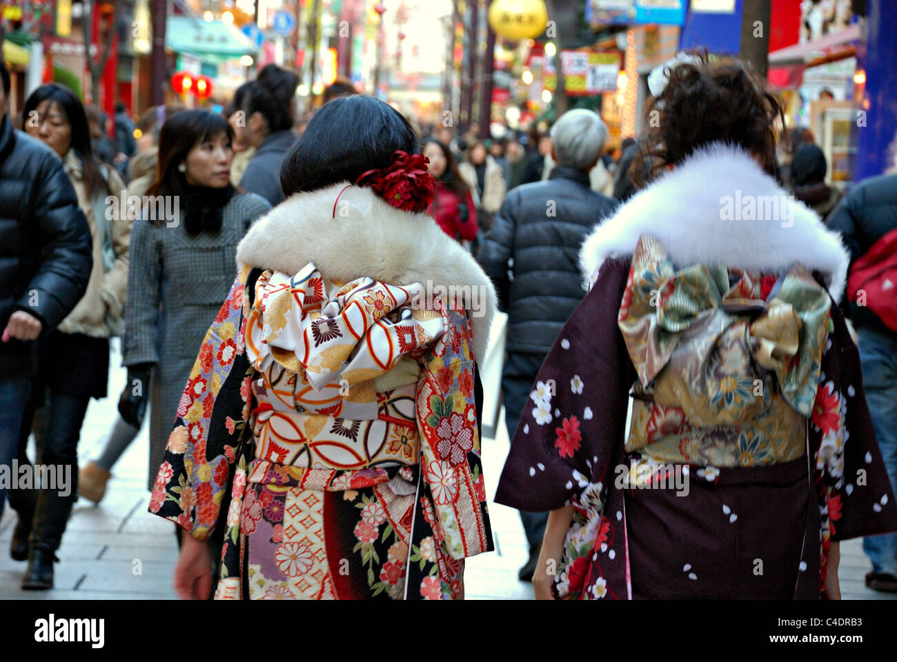 Two young girls dressed in traditional garb celebrate their coming of age during an annual festival in January Stock Photo