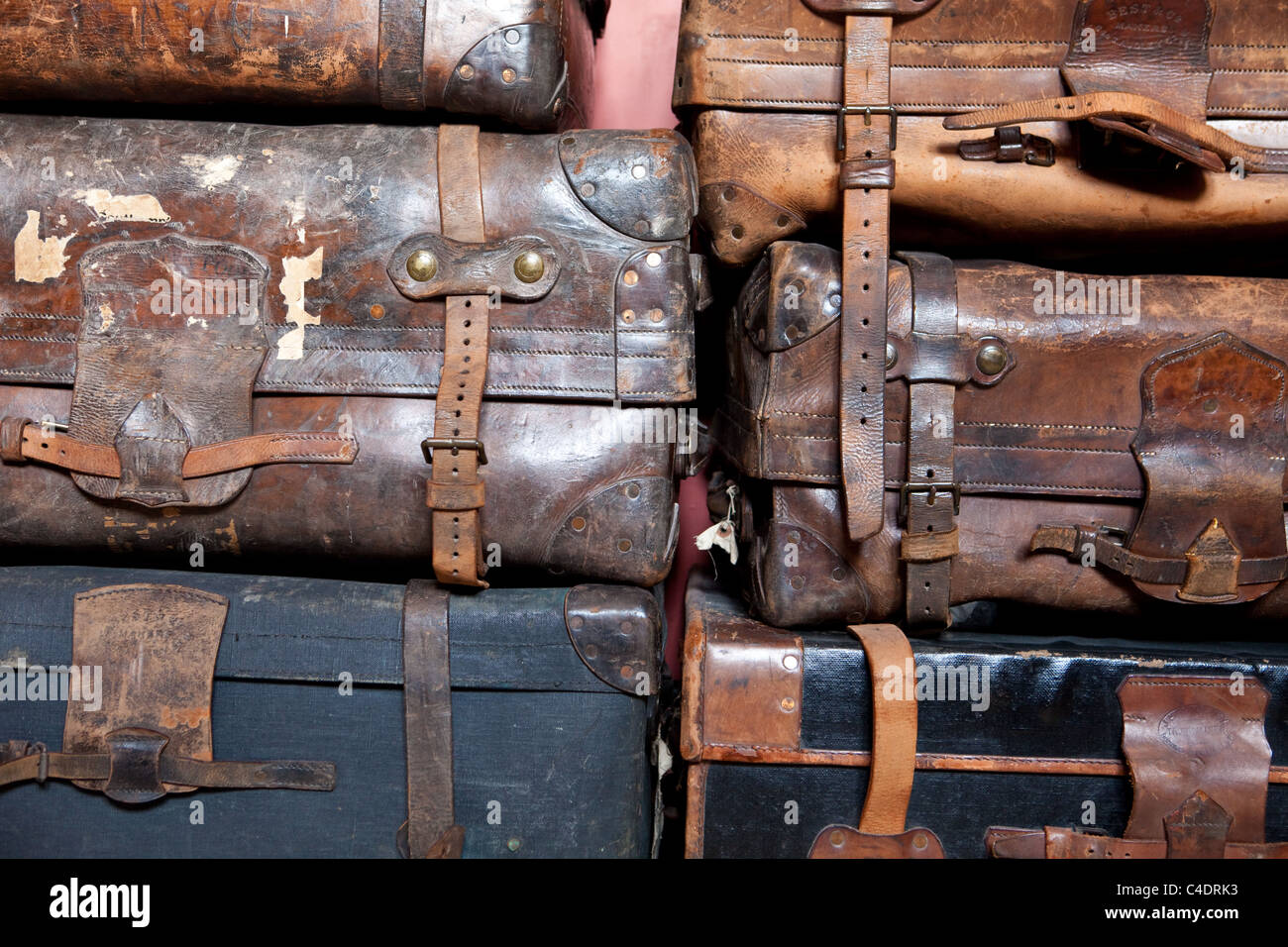 Old suitcases stacked Stock Photo Alamy