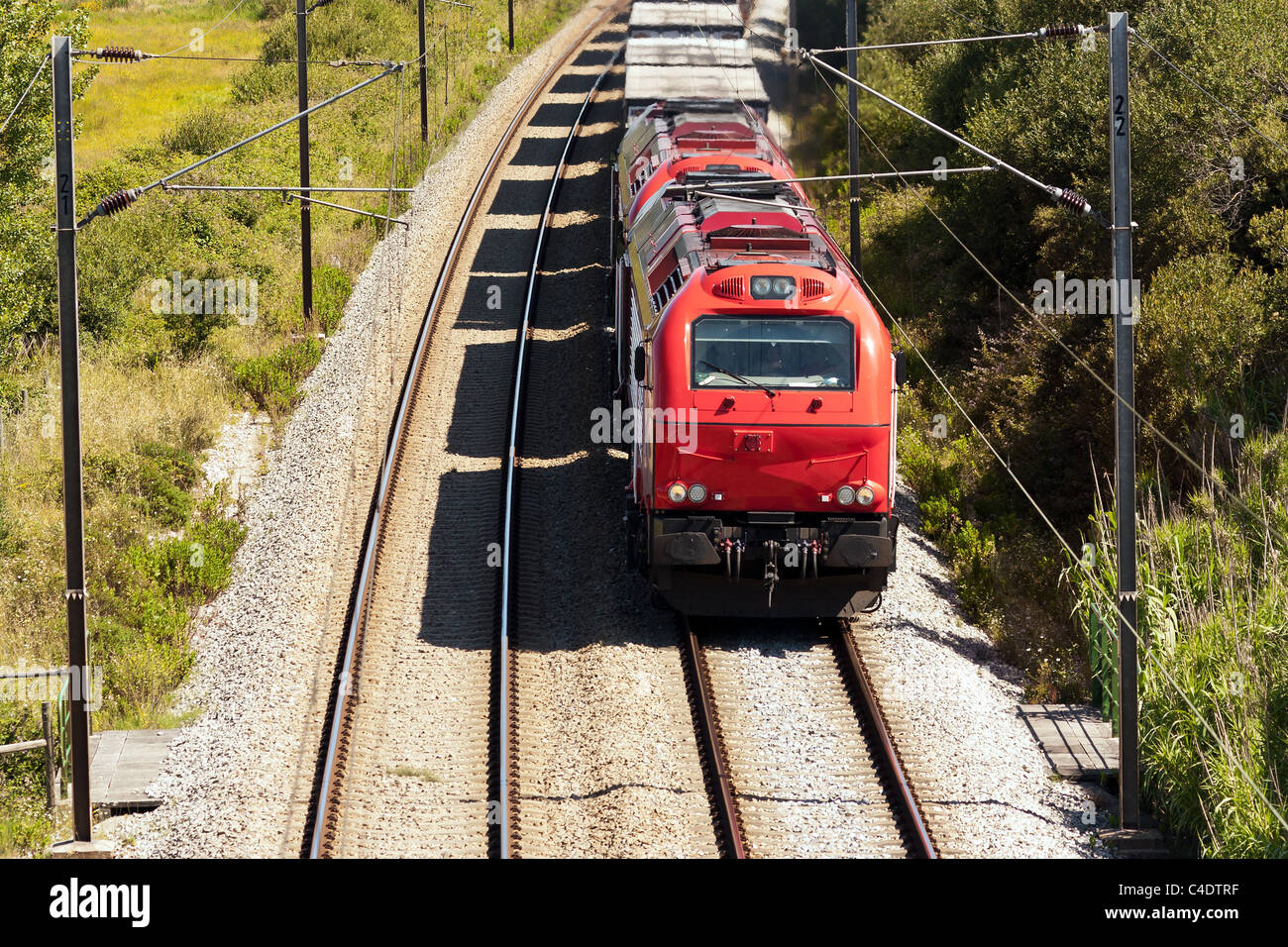 Cargo Train passing with some freight wagons, in Portugal Stock Photo