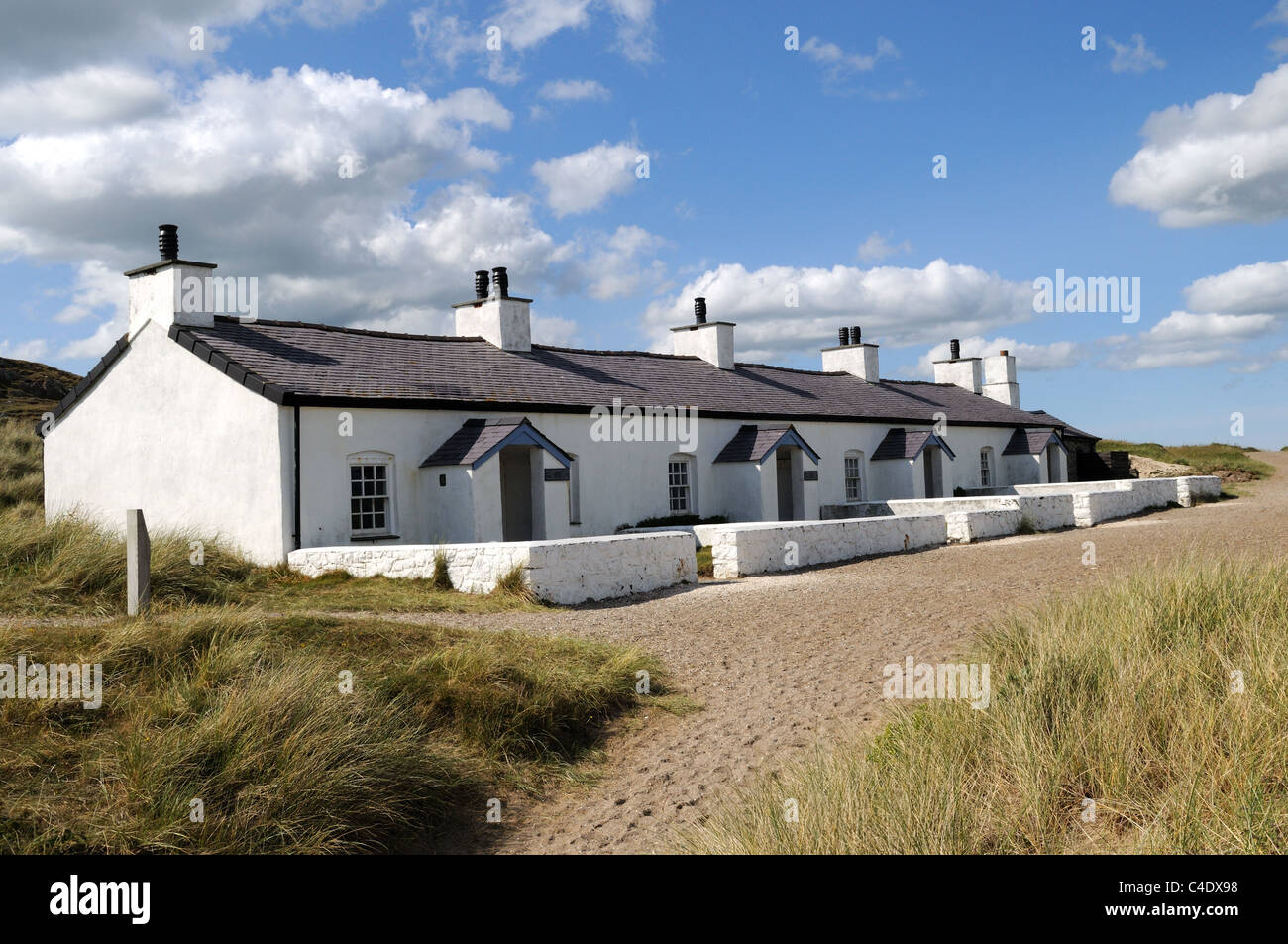 Old Pilot Cottages on Llanddwyn Island Newborough  Anglesey  Sir Fon Gwynedd Wales Cymru UK  GB Stock Photo